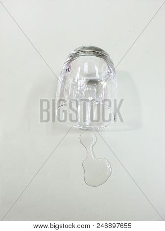 Water Glass Fall Down On The Table.