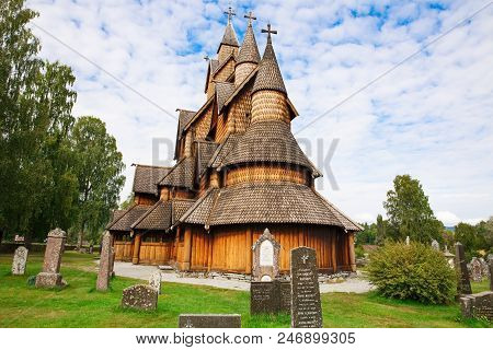 Heddal, Norway-august 15, 2014 -  Old Stave Church And Cemetery In Norwegian Village.