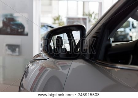 Reflection In Side Mirror Of The Interior Of The New Car. Modern Transportation.