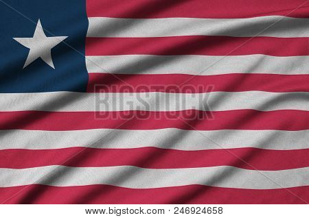 Liberia Flag  Is Depicted On A Sports Cloth Fabric With Many Folds. Sport Team Waving Banner