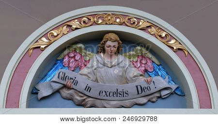 STITAR, CROATIA - NOVEMBER 30: Angel with Gloria in excelsis Deo Banner, Nativity Scene, altarpiece in the church of Saint Matthew in Stitar, Croatia on November 30, 2017.
