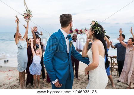 Young couple in a wedding ceremony at the beach