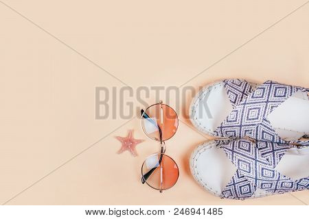 Summer Fashion Flatlay With Gradient Round Sunglasses And Espadrille Sandals On The Beige Background