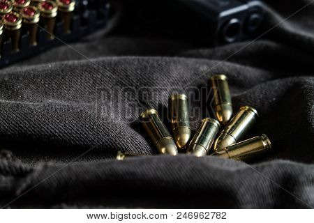 9Mm Semi Autometic Hand Gun With Fmj Bullet On Fabric
