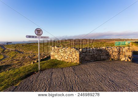 Signpost At Lands End Cornwall Uk, The Most Westerly Point Of England On The Penwith Peninsula. Suns