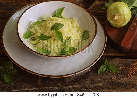 Fresh Salad With Kohlrabi, Parmesan, Basil And Sesame Dresing In A Bowl. Vegetarian Food