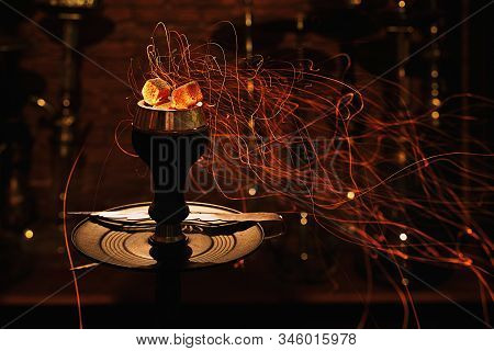 Shisha Hookah Bowl With Red Hot Coals And Craft Tobacco. Modern Hookah With Coconut Charcoal For Rel