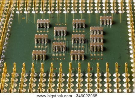 Old Computer Processor With Gold-plated Legs, Microcircuits On It, Super Macro Photo
