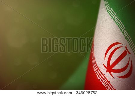 Iran Hanging Flag For Honour Of Veterans Day Or Memorial Day On Green Dark Velvet Background. Iran G