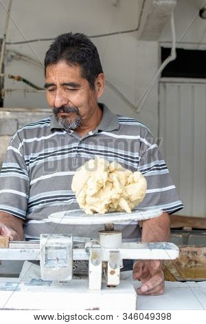 Man Selling Dough In Nixtamal Mill