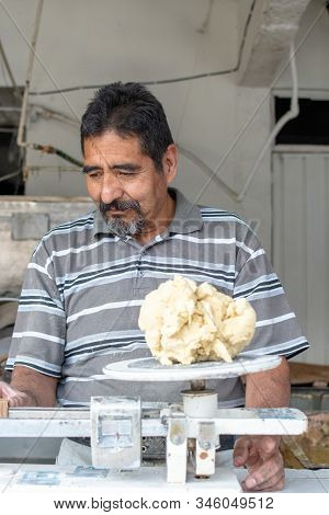Man Selling Dough In Nixtamal Mill