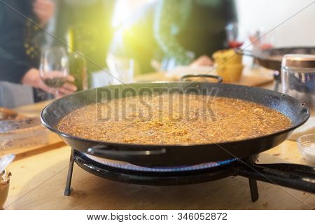 Paella Pan With Traditional Spanish Food Usually Prepared With Rice, Meat, Seafood. Horizontal Orien