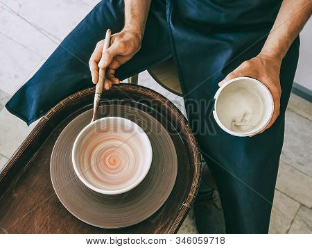 Ceramist At A Pottery Workshop Topv View Photo