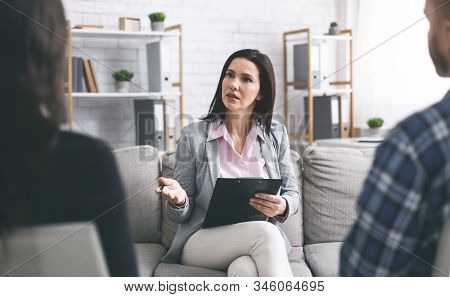 Marital Psychology. Therapist Talking With Married Patients During Private Consultation