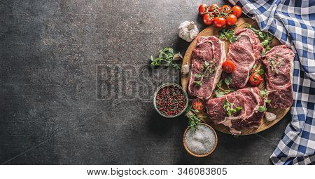Beef Ribe Eye Steaks With Rosemary Oregano And Tomatoes Top Of View.