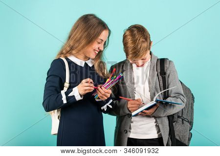 Before Examination. Small Children Prepare For Examination. Little Girl And Boy Hold Examination Pap