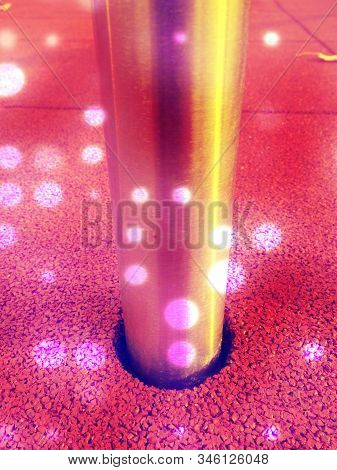 Detail Of Rubbery Ground Beside Stainless Steel Pole  Abstract Filter.