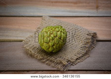 Fresh Custard Apple On Wooden Table Background