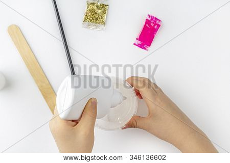 Step By Step Photo Instruction: How To Make Slime At Home. The Concept Of Diy.  Ingridients For Maki