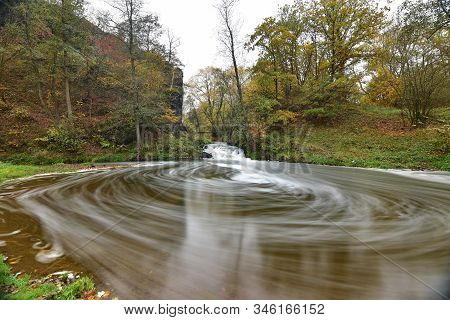 Autumn Colors In A Slowly Flowing Creek