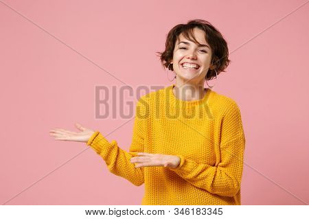 Smiling Joyful Young Brunette Woman Girl In Yellow Sweater Posing Isolated On Pink Wall Background S