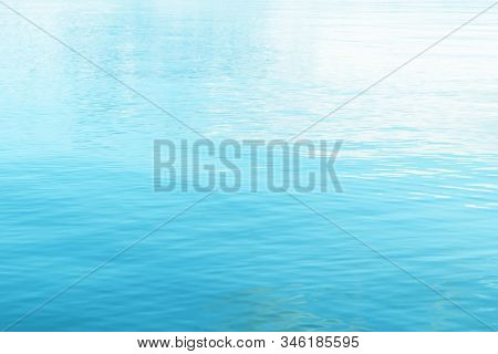 Tranquil Surface Texture Of The Ocean. Water Ripples. Blue Sea Water In Calm. Crystal Clear Sea Wate