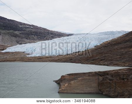 Austerdalsvatnet Lake Landscapes And European Svartisen Glacier In Nordland County In Norway, Cloudy