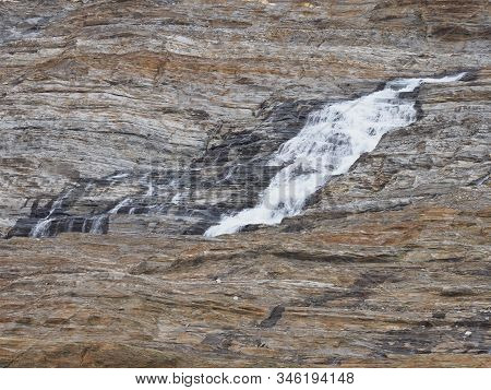 Waterfall Near Austerdalsvatnet Lake And European Svartisen Glacier In Nordland County In Norway In 