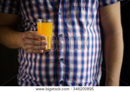 Food Calorific Value, Sugar Contain, Imbalanced Nutrition. Man Drinking Orange Soda, Close Up