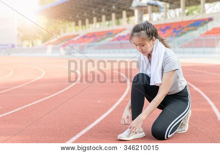 Athlete Girl Trying Running Shoes Getting Ready For Jogging On Track At Studium, Sport And Healthy C