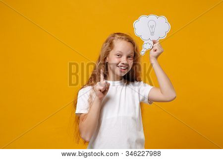 Little Ginger Kid Girl 12-13 Years Old In White T-shirt Isolated On Yellow Wall Background. Childhoo