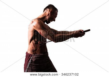 A Man With A Katana, In Blood, Makes Hara-kiri. Isolated On A White Background.