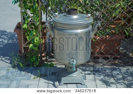 Old Shabby Iron Samovar .vintage Metal Copper Tea . Samovar Side View. Retro Soot Grunge Tea Samovar