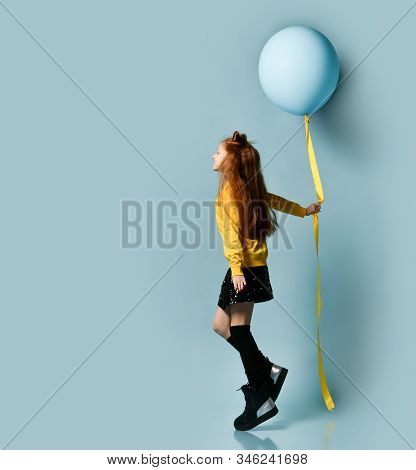 Red-headed Teenage Girl With Fancy Hairstyle In Yellow Sweatshirt, Black Skirt, Knee-highs, Boots. S