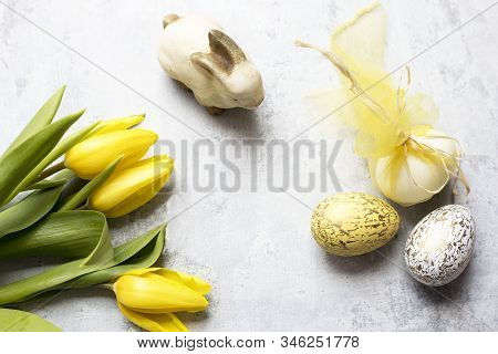 Easter Bunny With Yelow Tulips And Deco Eggs