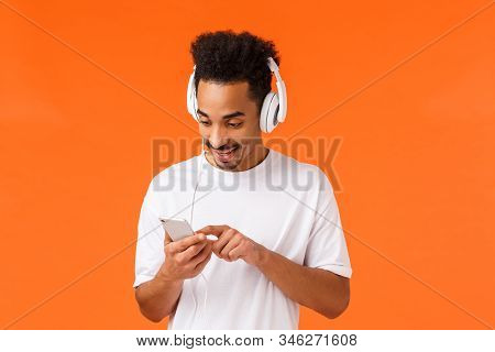 Guy Searching Right Track Boost Mood. Joyful Attractive African-american Man In White T-shirt, Put O