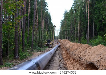 Natural Gas Pipeline Construction Work. A Dug Trench In The Ground For The Installation And Installa