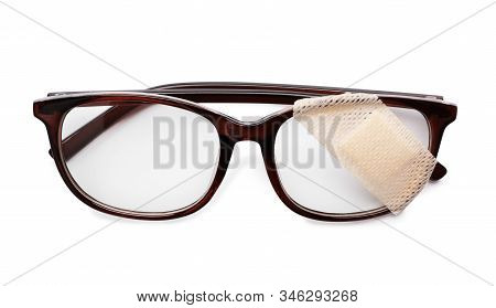 Glasses With Sticking Plaster Isolated On White, Top View