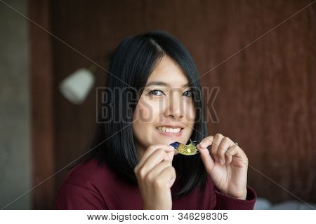 Asian Woman Using Braces Teeth Or Silicone Trainer To Mouth,orthodontic,dental Health Conceptclose U