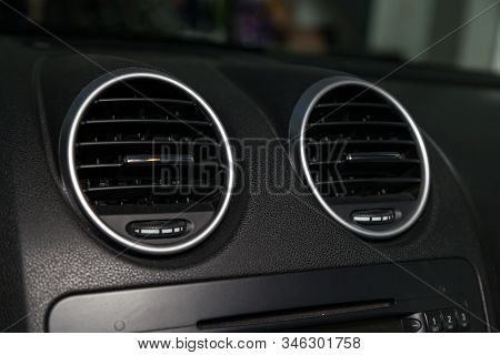 A Close-up View Of A Part Of The Interior Of A Modern Luxury Car With A View Of The Ventilation Chro
