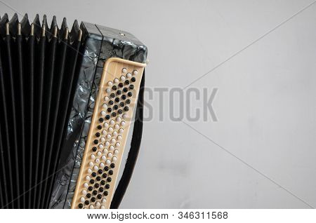 Fragment of classical retro bayan (accordion), musical instrument 