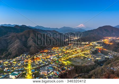 Otsuki, Japan skyline with Mt. Fuji at twilight.