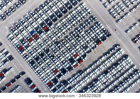 Aerial Top View New Cars Lined Up In The Port For Import Export Business Logistic And Transportation
