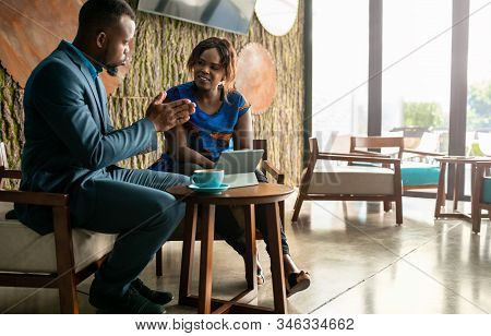 Wide Shot Business Meeting Consultation By Black African Financial Adviser With Flair Copyspace