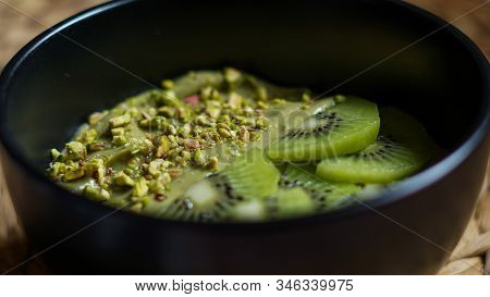 Avocado Mousse With Slices Kiwi And Crumbs Phistachios