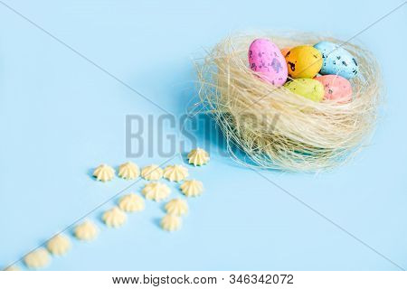 Plane Flies On Blue Background.yellow Sweets. Direction Sign For Easter Eggs. Spring And Easter Are 