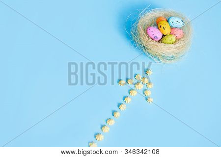 Plane Flies On Blue Background.yellow Sweets. Direction Sign For Easter Eggs. Spring And Easter Are 