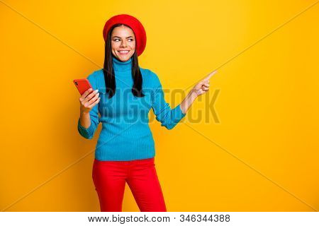 Portrait Of Nice Attractive Lovely Cheerful Cheery Girl Using Cell Showing Copy Space Ad Advert Stor