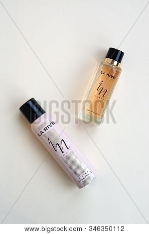 La Rive In Woman Deodorant And Perfume Bottles On Beige Background. La Rive S.a. Is One Of The Leadi