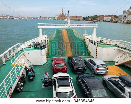 Lido, Italy - August 12, 2019: Ferry between Lido and Venice carries cars and passengers